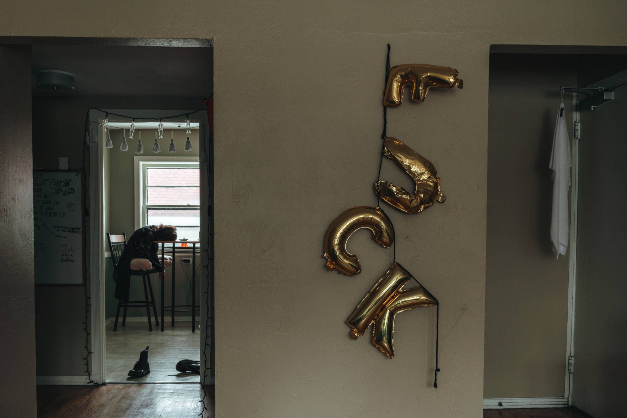 milar letter balloons attached to wall that spell "F U C K"